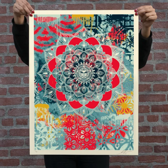 This Chaos Mandala print merges two seemingly contrasting concepts and aesthetics…chaos and harmony. I have always been fascinated by the cyclical chaos of posters and graffiti accumulating on the streets and then being ripped at by humans and the elements. There is beauty in the layering and in accepting that there are too many variables of push and pull for any of us to control them all. For me, the philosophy to embrace is “enjoy the ride and savor the ephemeral”. In my backgrounds I’m often trying to replicate in my studio the charm of the layering and chaos one finds on the streets but using my own patterns and collage. Mandalas on the other hand are symbols of harmony, wholeness, and the universe in its ideal form. Chaos and harmony might seem hard to reconcile, but Buddhist monks poetically address the paradox of striving for harmony but accepting impermanence and destruction with their rituals of creating and destroying elaborate sand mandalas. This Chaos Mandala print is a blend of all of these ideas.
-Shepard

PRINT DETAILS
Chaos Mandala. 18 x 24 inches. Screen print on 80# cream Speckletone paper. Signed by Shepard Fairey. Numbered edition of 550. Comes with a Digital Certificate of Authenticity provided by Verisart. $60. Available on Thursday, March 13th @ 10 AM PDT at Obey Giant Store. Max order: 1 per customer/household. International customers are responsible for import fees due upon delivery (Except UK orders under $160).⁣ ALL SALES FINAL.