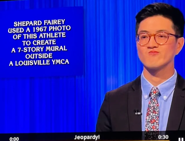 My art was a Jeopardy clue on an episode last week.

WHO IS MUHAMMAD ALI?

Here’s a look back at the mural and the show. It’s always kind of crazy to me to be part of this. If you’re in Louisville, check it out and thanks for the support! - S

Illustration of Muhammad Ali based on photo by Howard Bingham

Mural 📷 by @jonathanfurlong 
 
#jeopardy #obey #shepardfairey #muhammadali #louisville @jeopardy