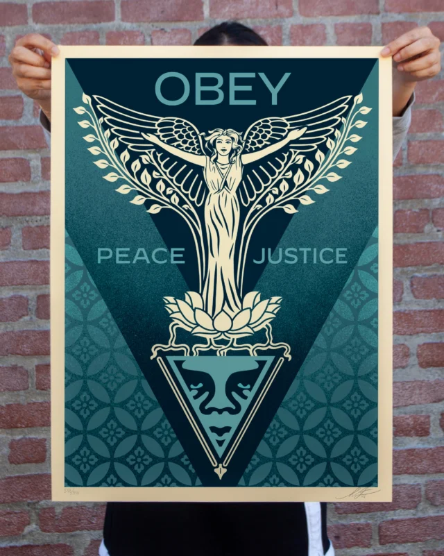 This Nouveau Angel print is inspired by my love of Art Nouveau design and symbolism. Art Nouveau explored a counter-narrative to industrialization in which harmony with nature and a respect for its untamable aspects were spiritually embodied by floral and female forms. Of course, angels symbolize guidance and protection, so the themes of Art Nouveau combined with my belief that women are leaders in the building of a more peaceful and just society led me directly to this combination of style and subject matter. Let your better angels guide you to help peace and justice bloom!
-Shepard

PRINT DETAILS: Nouveau Angel. 24” H x 18” W. Screen print on 80# cream Speckletone paper. Signed by Shepard Fairey. Numbered edition of 550. Comes with a Digital Certificate of Authenticity provided by Verisart. $65. Available on Thursday, June 18th @ 10 AM PDT at https://store.obeygiant.com. Max order: 1 per customer/household. International customers are responsible for import fees due upon delivery (Except UK orders under $160).⁣ ALL SALES FINAL.