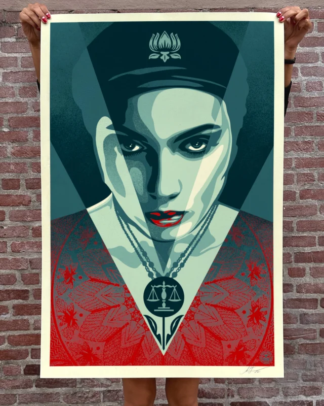 The Justice Woman print is a tribute to all warriors for justice whose determination and tenacity bend the arc of the universe toward the just future we need. Justice is a constantly evolving idea when it comes to various issues, but generally speaking, those willing to listen to their conscience, look their fellow human beings in the eyes, and stand up for what is right are setting an important example and can influence people to treat others as they’d like to be treated. I chose a woman for this image because, in my experience, women are more likely to fight for justice for all, while men often narcissistically serve their self-interest. Of course, this is a generalization, and there are generous people of every gender and orientation, but men have far too much of a monopoly on leadership roles. I’d like to see the female perspective equally represented in every facet of society. Especially with the current administration’s anti-diversity efforts creating roadblocks for equality, we need to do what is right! If you’ve ever stood up for any form of justice- equality, environmental protection, human rights, etc. THANK YOU! –Shepard

PRINT DETAILS: Justice Woman. 36” H x 24” W. Offset on thick cream Speckletone paper. Signed by Shepard Fairey. Open Edition (not numbered). $35. Available now at store.obeygiant.com. International customers are responsible for any applicable import duties, taxes and customs fees due upon delivery, except for UK orders under $160 USD and EU orders where taxes are collected at checkout.⁣